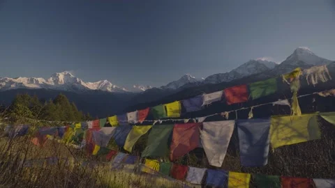 Colorful Himalaya Prayer Flags blowing with Mountain view from Poon Hill Stock Footage