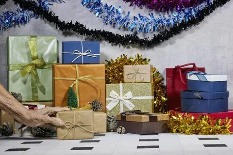 Colorful Holiday Gift Stack With Bows, Garlands, and Festive Decor for Christmas Stock Photos