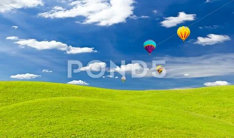 Colorful hot air balloon against blue sky Stock Photos