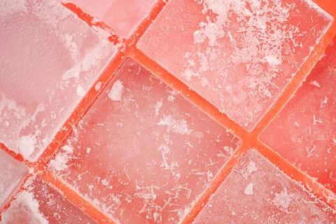 Colorful ice cubes on a flat surface during daylight hours Stock Photos