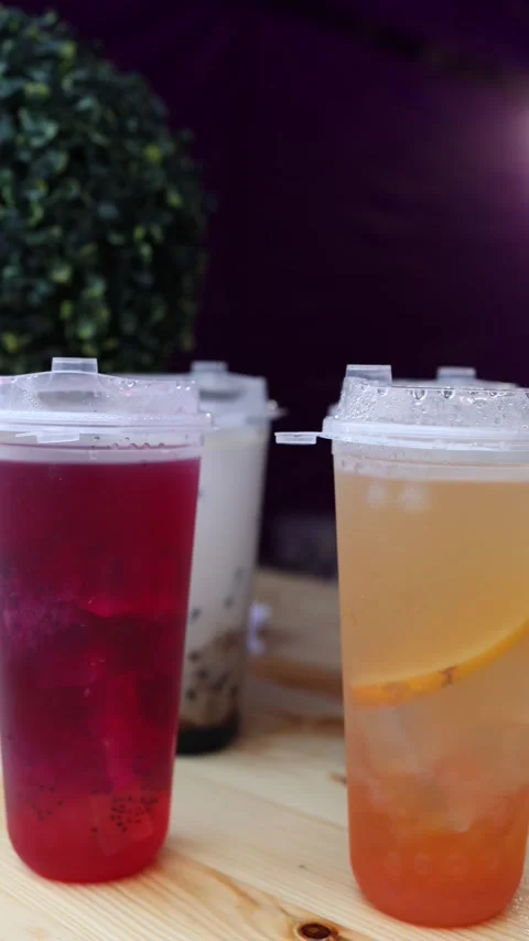 Colorful iced drinks on table Stock Footage 336526524