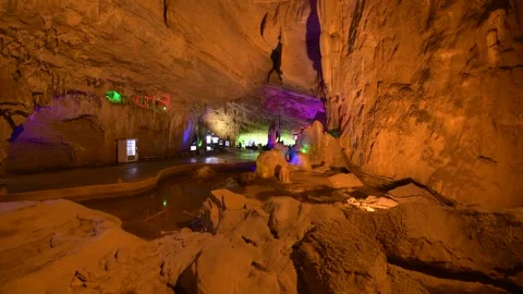 Colorful Illuminated Rock Formations Inside Large Limestone Cave Stock Footage 341957036