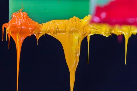 Colorful ink flow down from printer handle Stock Photos