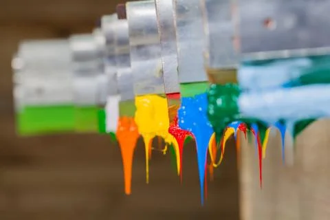 Colorful ink flow down from printer handle Stock Photos