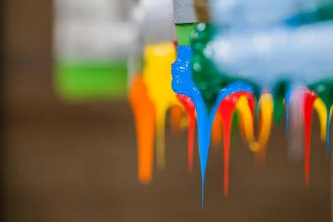 Colorful ink flow down from printer handle Stock Photos