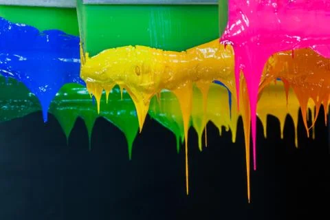 Colorful ink flow down from printer handle Stock Photos
