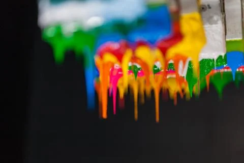 Colorful ink flow down from printer handle Stock-Fotos