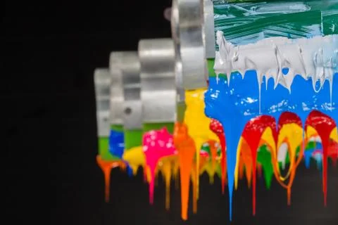 Colorful ink flow down from printer handle Stock Photos