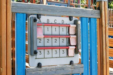 Colorful interactive abacus-style educational panel in a children's playgroun Stock Photos