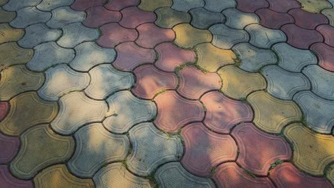 Colorful Interlocking Tiles in Sunlit Shadows Stock Footage 323085386