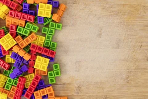 Colorful Interlocking Tower Blocks with Blank Space for Text on Wooden Back.. 스톡 사진