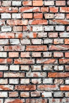 Colorful irregular brick wall texture or background. Stock Photos