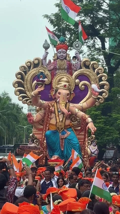 Colorful Joyous Procession taking Large Ornate Ganesh Idol to Display Venue Stockbeeldmateriaal 342433472