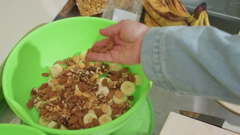 Colorful kitchen scene with nuts, Vibrant image of healthy snack assembly Stock Footage 327810459