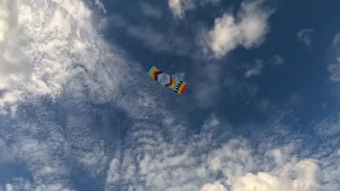 Colorful kites shaped like rectangle soaring high in the blue sky clouds. Stock Footage 303963493