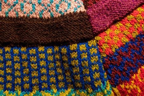 Colorful knitted wool textured patchwork fabric background Stock Photos
