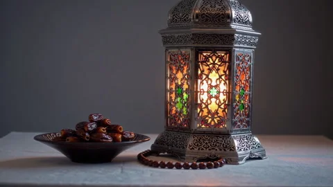 A Colorful Lantern Accompanied by Dates and Beads Delicately Displayed on a Stock Footage 306018092