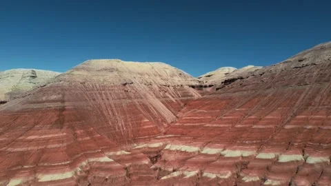 Colorful layered rock formations with red and white stripes in Altyn Emel Stock Footage 345410051