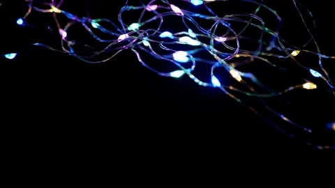 Colorful LED String Lights Blinking Against Solid Black Background Stock Footage 332662762