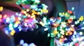 Colorful LED throwies in hands - many colorful bundles in many hands HD Footage