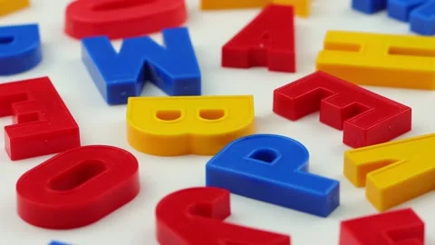 Colorful letters rotate on a white background. Stock Footage 219212359