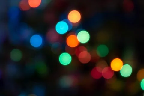 Colorful light bulbs and vivid round bokeh lights tree festive mood lightning Stock Photos