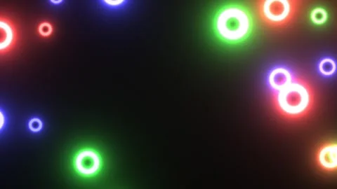 Colorful light circles on dark background create a bright Stock Footage 338399484