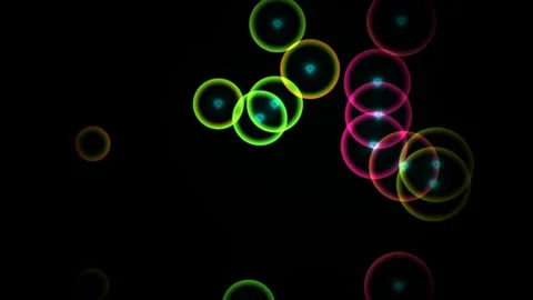 Colorful light circles move on a black background Stock Footage 338292121