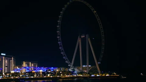 Colorful Light From The Ferris Wheel Lighting The Arabic Coast Stock Footage 273590891