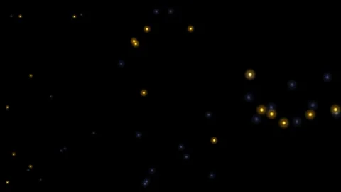 Colorful light particles move in a dark background at night Stock Footage 339590531