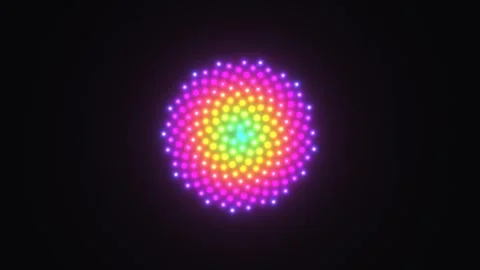 Colorful light pattern creates a spiral design on a dark Stock Footage 338037321