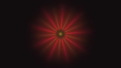 Colorful light patterns create a starburst effect in dark Stock Footage 338124350