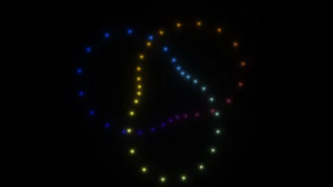 Colorful light patterns dance through the dark space at Stock Footage 338302168