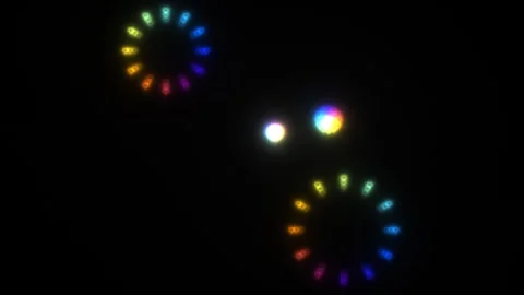 Colorful light patterns on a dark background create a Stock Footage 338289900