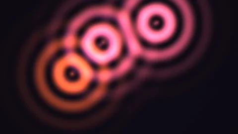 Colorful light patterns move in circles with a dark Stock Footage 338004612