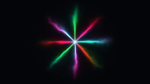 Colorful light rays create a star-shaped pattern on a dark Stock Footage 338132338