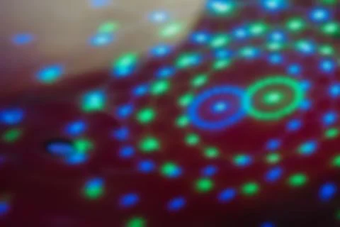 Colorful lights create patterns on  surface during  lively night event at  pa Stock Photos
