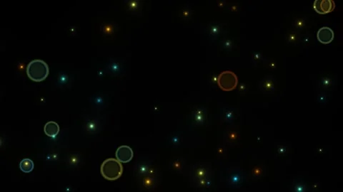 Colorful lights floating in dark background create a Stock Footage 338418986