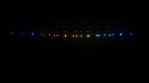 Colorful lights illuminate a dark surface in a steady 库存影片 339329595