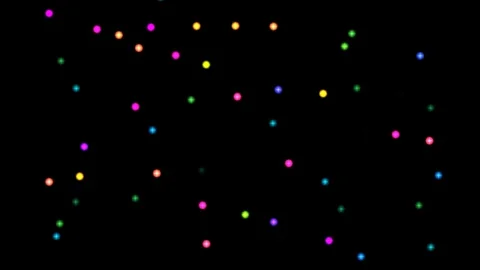 Colorful lights move in a dark space during a nighttime Stock Footage 338241511