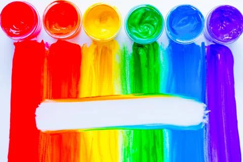 Colorful lines drawn vertically with paint in the form of a rainbow with a white Stock Photos