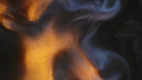 Colorful liquid paint abstract background. Acrylic paints with golden glitter Stock Footage 278650557