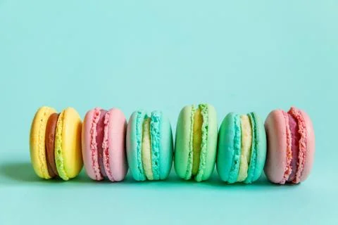 Colorful macaron on blue background Stock Photos