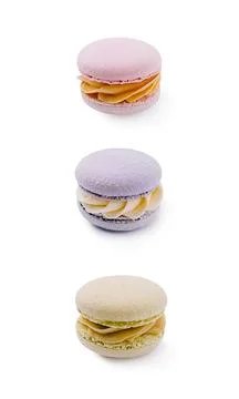 Colorful macarons arranged in a vertical stack on a white background 스톡 사진
