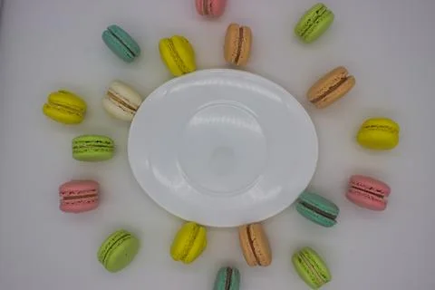 Colorful Macarons in a Circle Around an Empty Plate Stock Photos