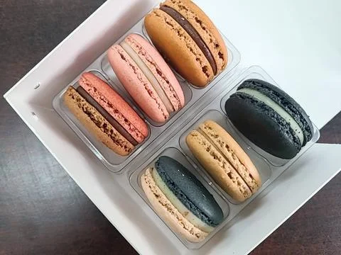 Colorful macarons with a delicate, crispy shell and soft, flavorful filling.. Stock Photos