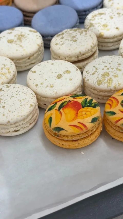 Colorful macarons with floral patterns arranged on a tray for display or ba.. Stock Footage 319037717