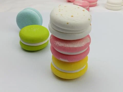 Colorful macarons stacked on white background Stock Photos