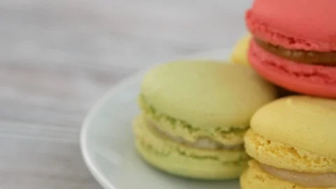Colorful Macarons On A White Plate Video stock 114026080