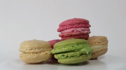 Colorful Macaroons rotating on a white background Stock Footage 59702057